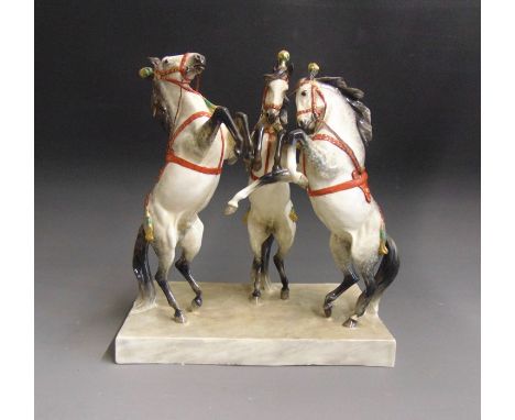 Doris Lindner for Royal Worcester, ‘Circus Horses’ featuring three rearing circus horses on a porcelain plinth, the horses ar