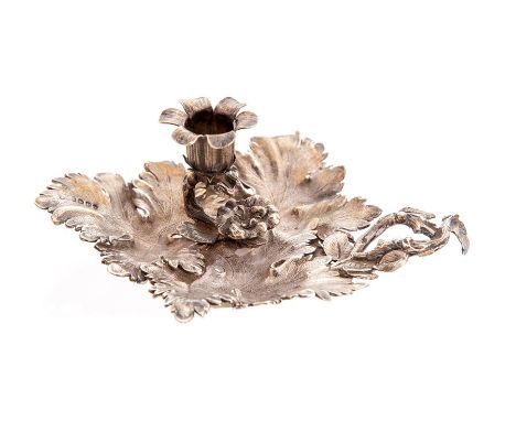 A William IV silver chamber stick, the base being made from overlapping leaves with a leaf and branch finger holder and flowe