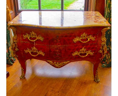 A 19th Century French kingwood commode, of bombe form, marble topped, comprising two fitted drawers, applied with ormolu moun