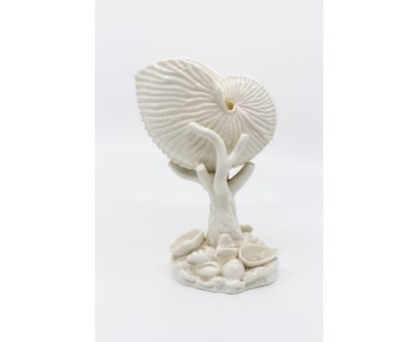 A Royal Worcester Nautilus shall vase raised on a coral stem and shell encrusted base, H. 17cms.