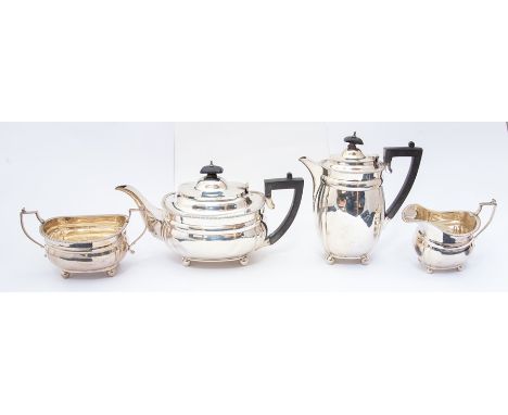 A Victorian four piece silver  tea service comprising teapot, hot water jug, sugar bowl and milk jug, the  gadroon border abo