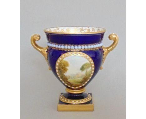 A Royal Worcester twin handled vase, cobalt blue ground with a painted reserve of Malvern, 1870,  signed Rushton, date code f