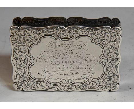 A Victorian&nbsp;presentation snuff box, shaped rectangular the entire chased with scrolling flowers and foliage, the central