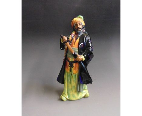 A Royal Doulton figure of Bluebeard, highly decorated in blue, purple, orange, green  & yellowby Leslie Harradine, circa 1932