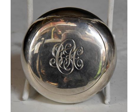 A Victorian silver plain circular snuff box, with squeeze opening mechanism, the cover engraved with initials, gilt interior,