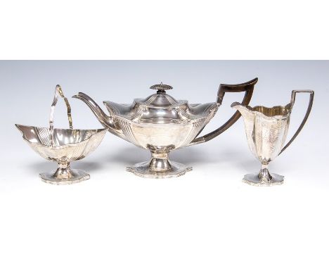 A matched 19th Century silver three piece silver tea service comprising teapot, sugar bowl and milk jug, wavy rim above flute