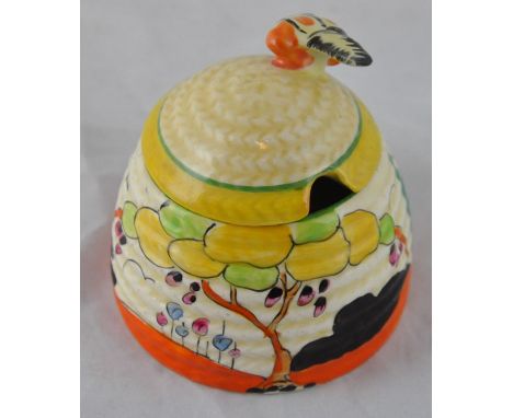 Clarice Cliff for Wilkinson, a small Tulips beehive honey pot, Bizarre mark, 7.5cm highCONDITION:Lid restored to finial and r