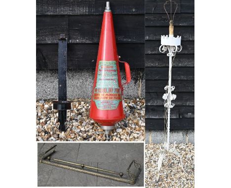 An old brass curb fender to/with a 1960s cone fire extinguisher and a white painted wrought steel standard lamp (3)