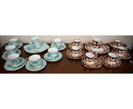 A Royal Albert china tea service, floral-printed on a pale blue ground, 21 pieces, to/w a Royal Albert 'Royalty' pattern serv