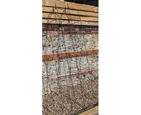 A pair of weathered steel arrow head garden obelisks,&nbsp;217 cm x 44 cm