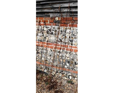 A pair of weathered steel arrow head garden obelisks, 197 cm x 28 cm