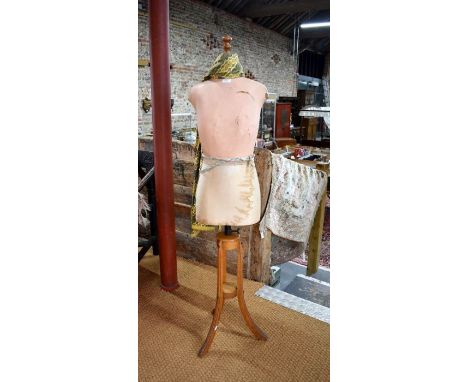 A vintage composite and fabric dressmaker's form on oak tripod base, by Harris &amp; Sheldon Ltd, Birmingham