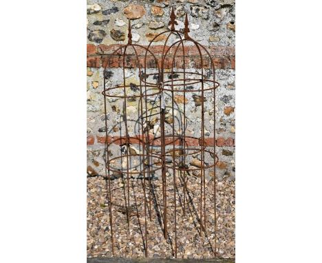 A trio of weathered steel arrow head garden obelisks,122 cm x 30 cm