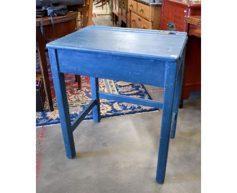 A vintage blue painted school desk