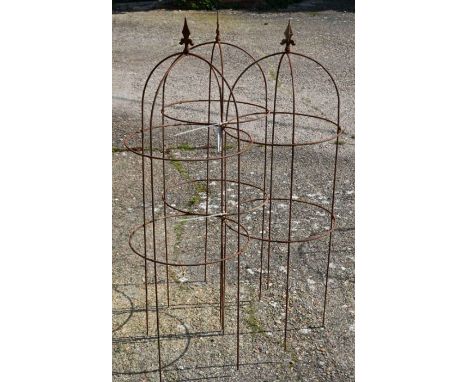 A trio of weathered steel arrow head garden obelisks,129 cm x 45 cm