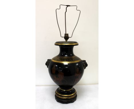 19th century Staffordshire black glazed terracotta vase of baluster form with twin lion mask handles, iron red transfer print