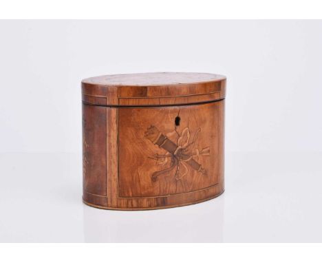 A Regency inlaid walnut tea caddyOf oval form, inlaid with marquetry trophies, swags and patera.14.5cm wide x 11cm highCondit