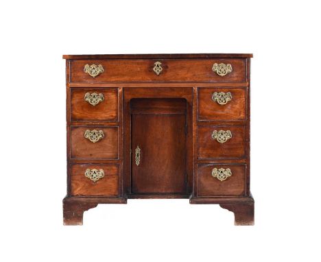 George III mahogany kneehole deskThe cross-banded top above a single frieze drawer, the kneehole flanked by six drawers with 