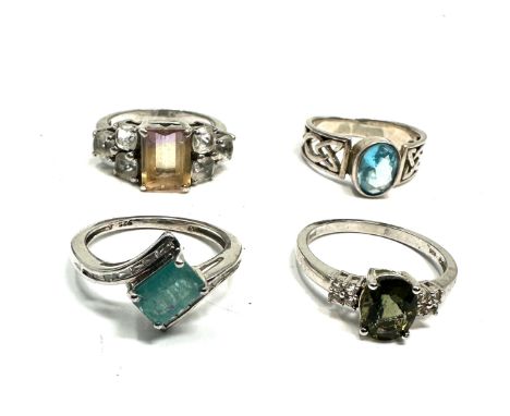 4 silver gemstone set rings 