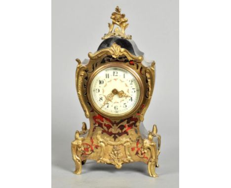A late 19c French mantel timepiece in waisted Rococo case with boullework front of cut brass and tortoiseshell mounted with g