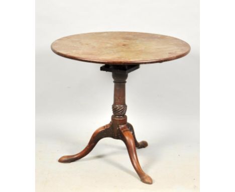 A George III mahogany tilt top birdcage tripod table, the tapering column writhen carved and raised on cabriole legs with pad