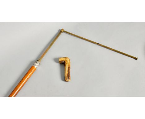 An Edwardian horse measure walking stick, with bamboo shaft, silver collar, London 1905 and antler handle which unscrews and 