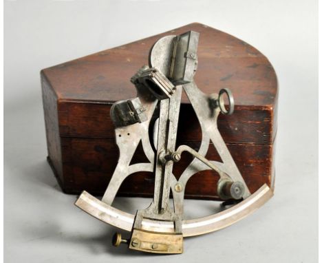 A mid 19c marine sextant with reflecting mirrors, set of filters and two lenses.  The scale is silvered and it has a wooden h