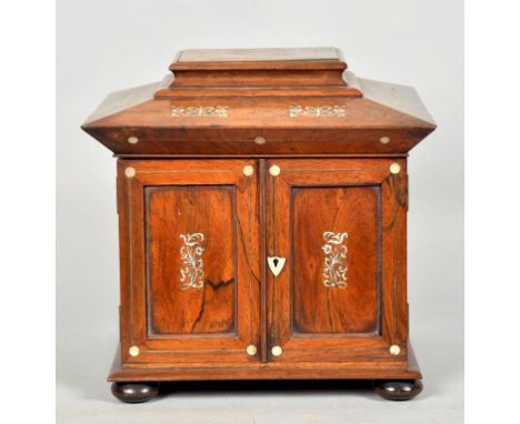 A George IV rosewood table top compendium cabinet with original fitted interior, red silk lined, the lid with a letter compar