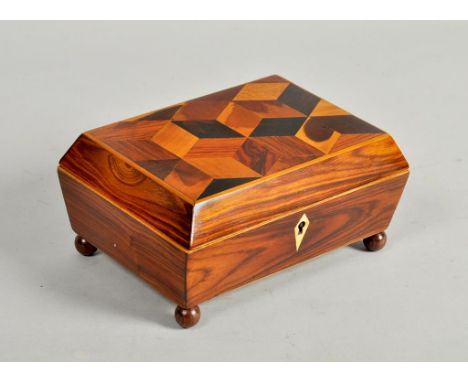 A 19c Tunbridge ware cubework decorated needlework box, the hinged cover with wide chamfered side panels enclosing a multi ti