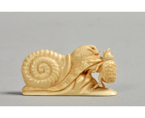 A Japanese Meiji period ivory netsuke in the form of a snail in combat with an insect, base signed, 2w.