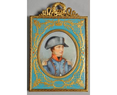 A 19c oval portrait miniature on ivory of a young Bonaparte, signed in mono BS, within a blue enamel and gilt easel frame wit