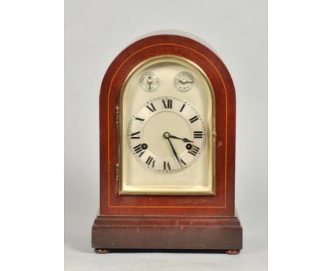 An early 20c German mantel clock in round top dark stained hardwood case with boxwood stringing to the front face.  The round