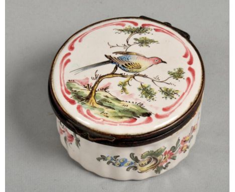 A 19c Continental enamel box of circular form, hand painted with floral sprays, the lid with a bird perched in a tree, painte