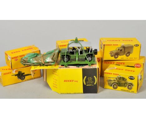 A collection of eight Dinky Toys military vehicles, including army one ton cargo truck no.641, scout car no.673, Austin Champ