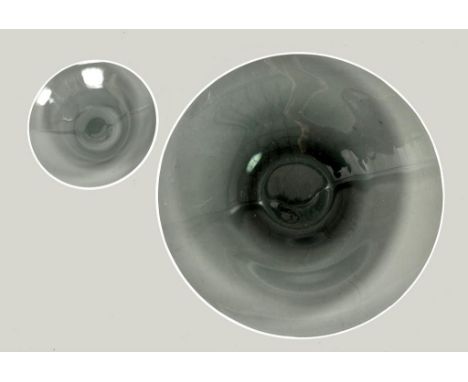 A 1960's art glass fruit set comprising of a circular serving dish 15diam and six shallow bowls 7.25diam, smoked grey with wh