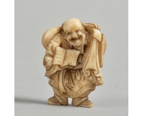 A Japanese Meiji period ivory netsuke carved as a travelling scribe, he with open book and carrying a large sack over his sho