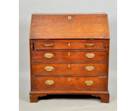 A George III yew wood veneered bureau with fall front and fitted interior, having one central cupboard, six pigeon holes and 