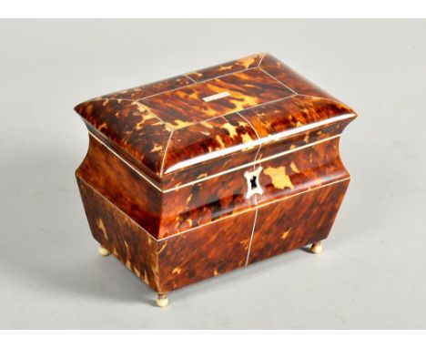 A 19c tortoiseshell panelled small two compartment tea caddy, with pewter line and ivory borders, supported on four ball feet