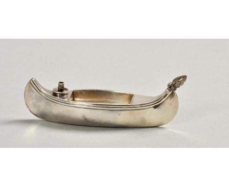 A late Victorian table lighter in the form of a canoe, with font and strike, makers mark for Stokes & Ireland Ltd, London 189