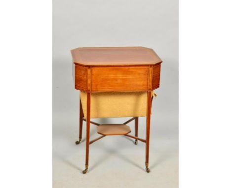 A Regency mahogany satinwood and ebony crossbanded needlework table of rectangular form with cut off corners, satinwood cross