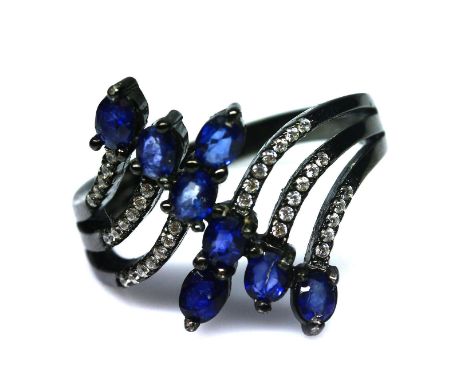A 925 silver ring set with marquise cut sapphires and white stones, (K).