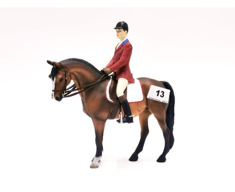 A North Light resin figure of a horse and jockey, H. 22cm.