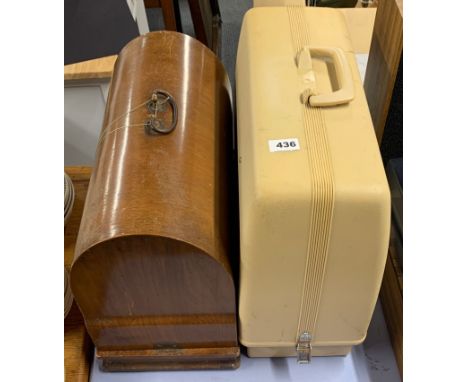 Two vintage sewing machines.