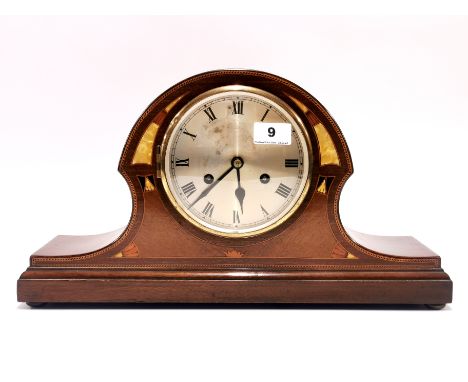 A 1920's mother of pearl inlaid striking mantle clock, 45 x 25cm. No key but appears to be in working order.