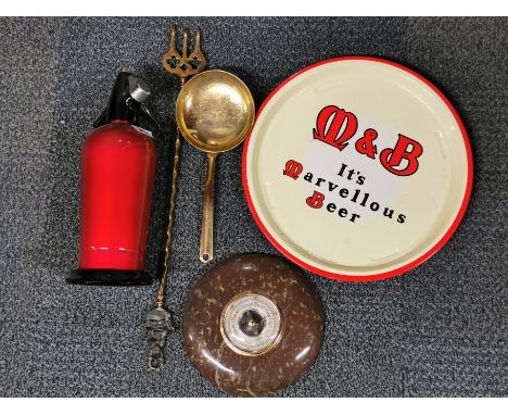 A M&amp;B bar tray with a soda siphon, granite barometer and two brass items.