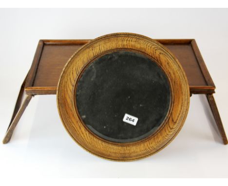 A 1930's folding oak lap tray and circular mirror, mirror Dia. 37cm.