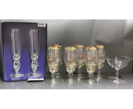 A pair of presentation Dartington crystal flutes, H. 24cm. together with a set of vintage lager glasses and a Orrefors glass.