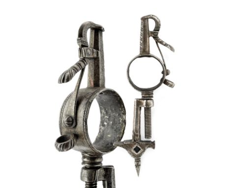 A rare powder-flask with tools dating: 17th Century provenance: Italy Flask consisting in a circular, iron band, the sides of