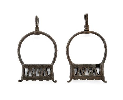 A pair of stirrups dating: circa 1700 provenance: Italy Iron stirrups, with pierced tread, pear-shaped arch with decorated bo