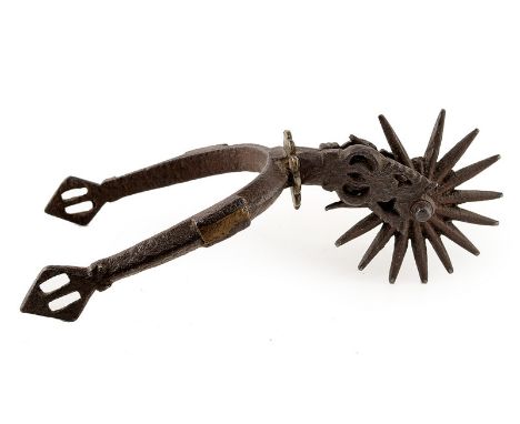 A spur dating: 18th Century provenance: Europe Iron heel band ribbed at the external surface, with brass inlays, lozenge-shap